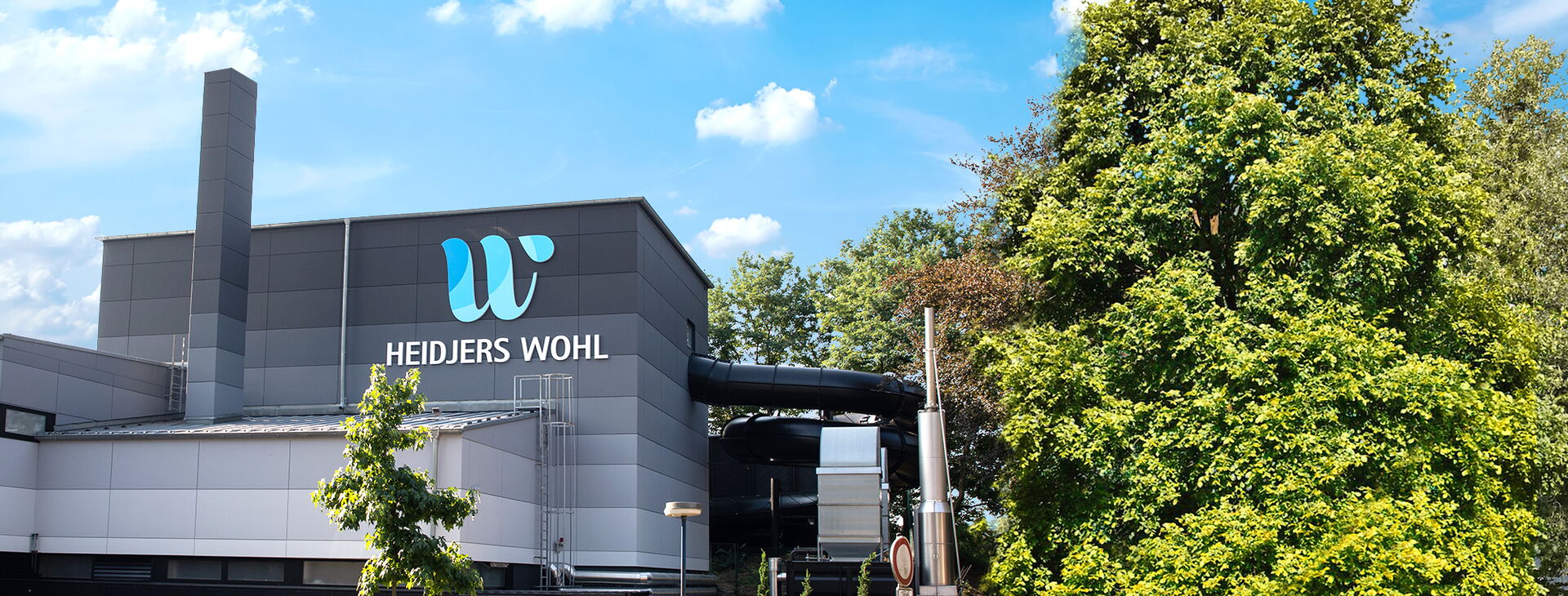 Außenansicht des Heidjers Wohl mit Rutsche in Schneverdingen